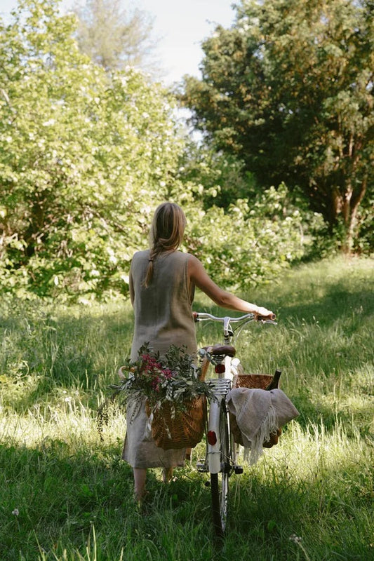 Woman outside with bike in the summer