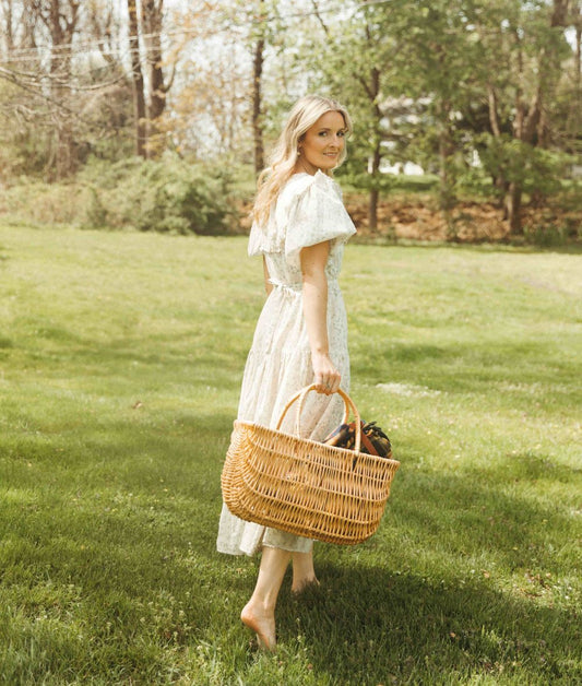 Woman in garden in summer sun hat