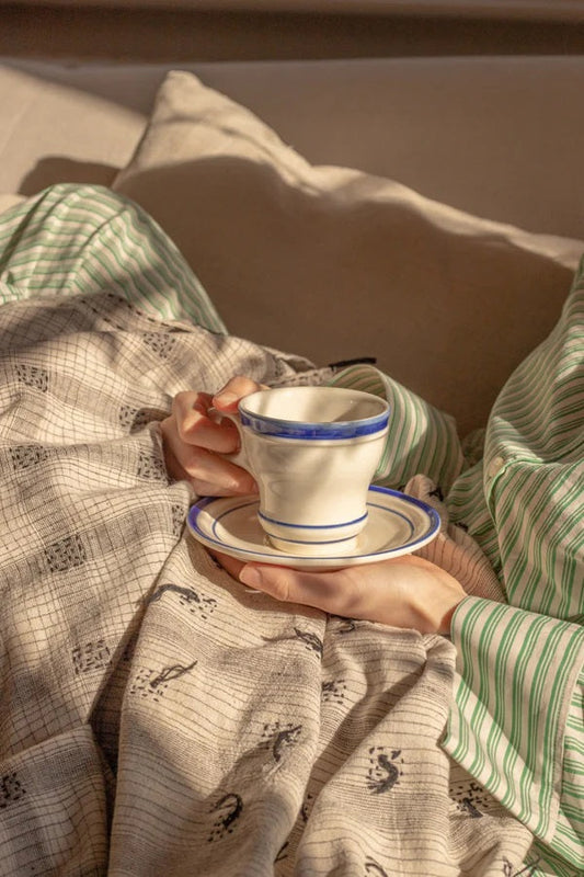 Enjoying a cup of coffee on the sofa in the sunshine