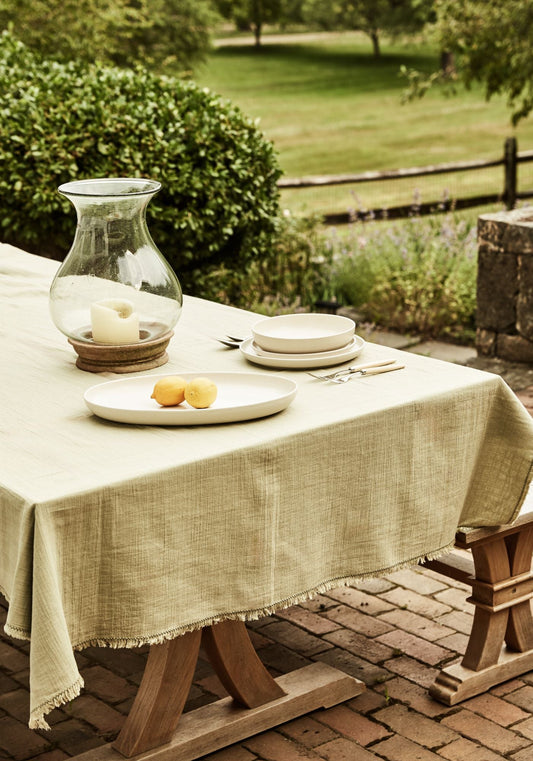 Alfresco summer table with hurricane lantern and stoneware