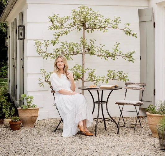 Woman in country garden in summer