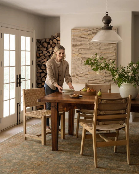 Woman setting the dinner table at home