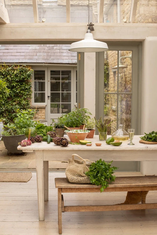 Summer kitchen table with doors out to the garden